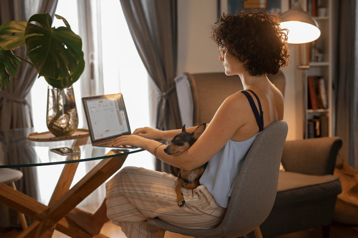 Remote worker with dog on lap