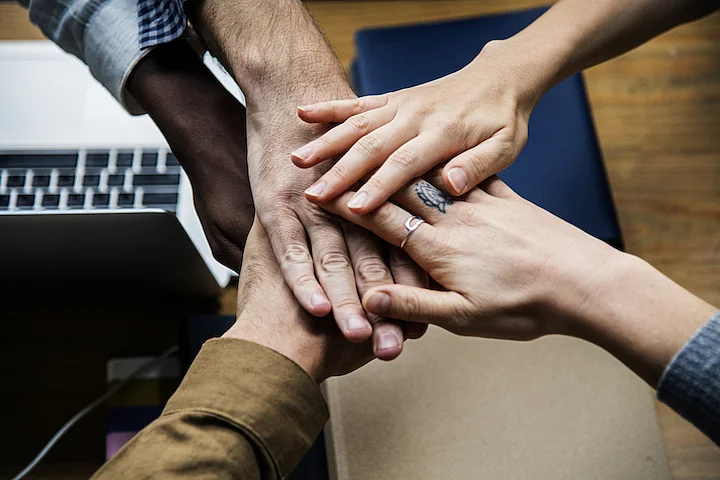 hands in from the entire team