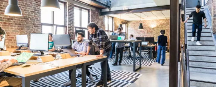 Team in an Open Workspace with Computers