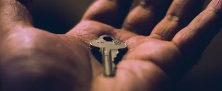 Hand holding a key