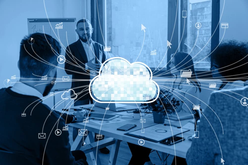 Cloud representing SaaS over business room meeting