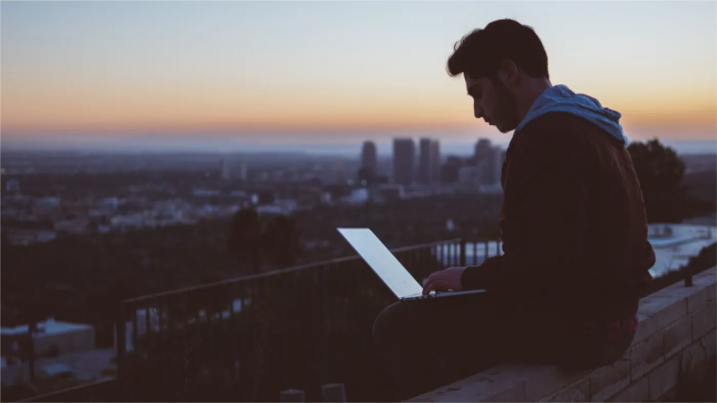 Remote worker cityscape sunset