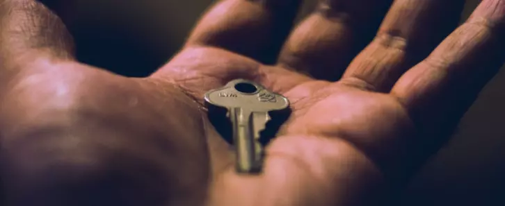 Hand holding a key